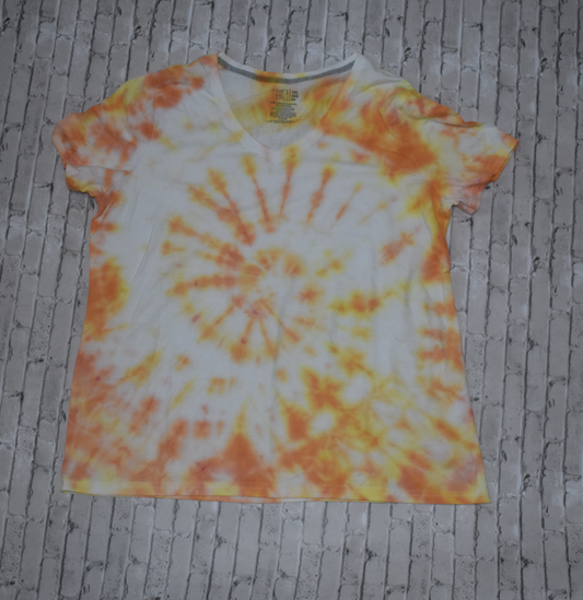 Tie-dye t-shirt with orange and white spiral pattern